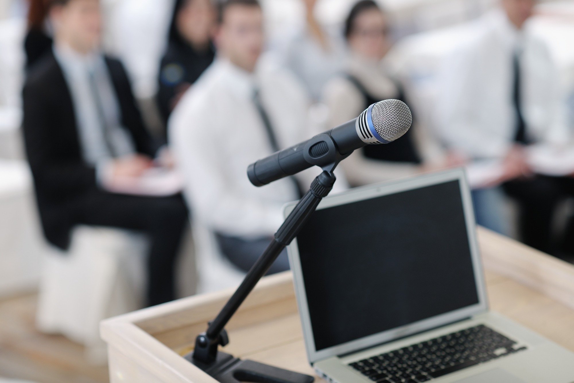 Laptop on conference speech podium.